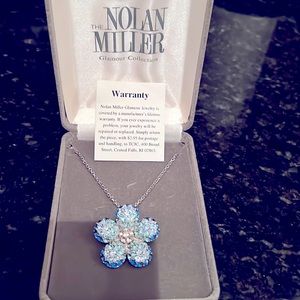 Nolan Miller blue pretty pave flower pin/ pendant.